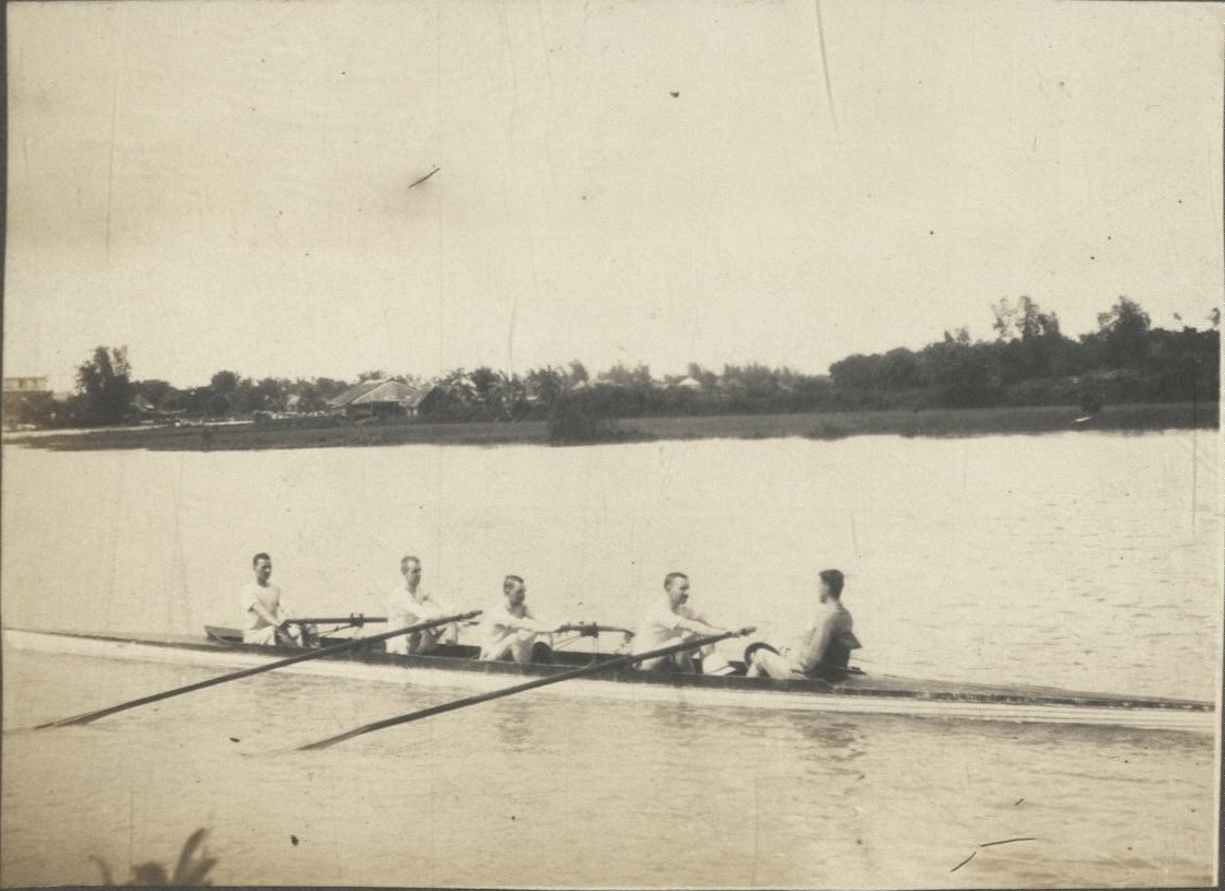[Untitled – Expatriates rowing in a four-man scull plus coxswain].