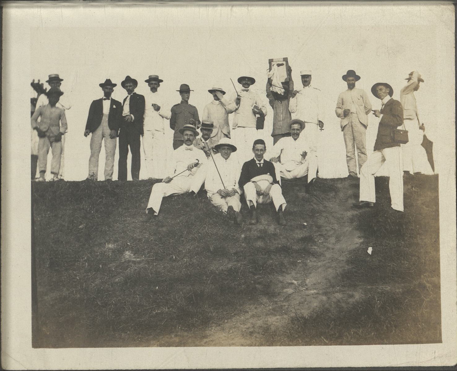 [Untitled – Group of expatriate men at crest of hill].