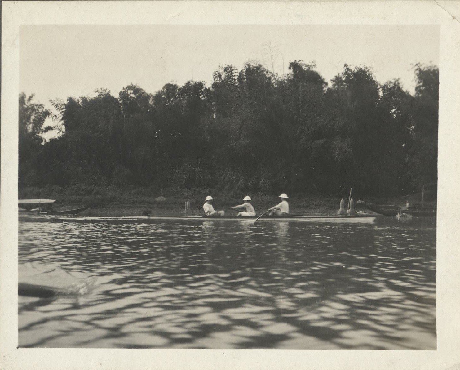 Johnston, Benson & Bessick [rowing in a two-man scull plus coxswain].