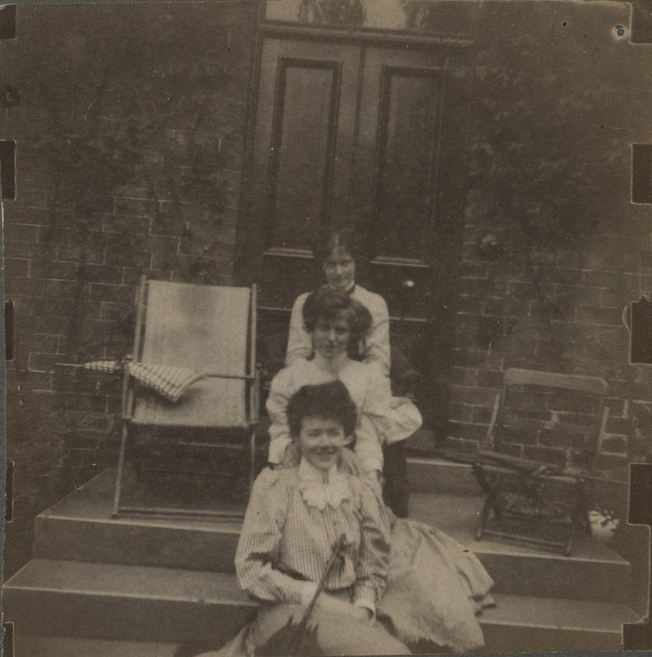 [Untitled – Three women sitting on steps].