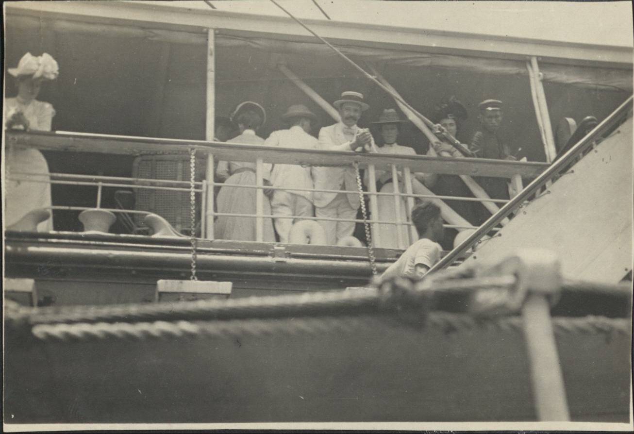 [Untitled – Expatriates on board an inter-island ship in port].