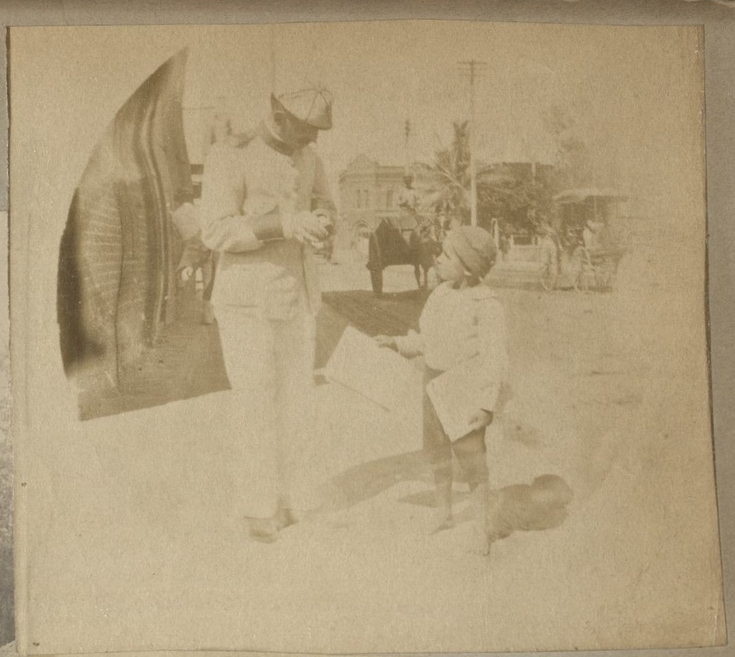 [Untitled – Soldier buying newspaper].