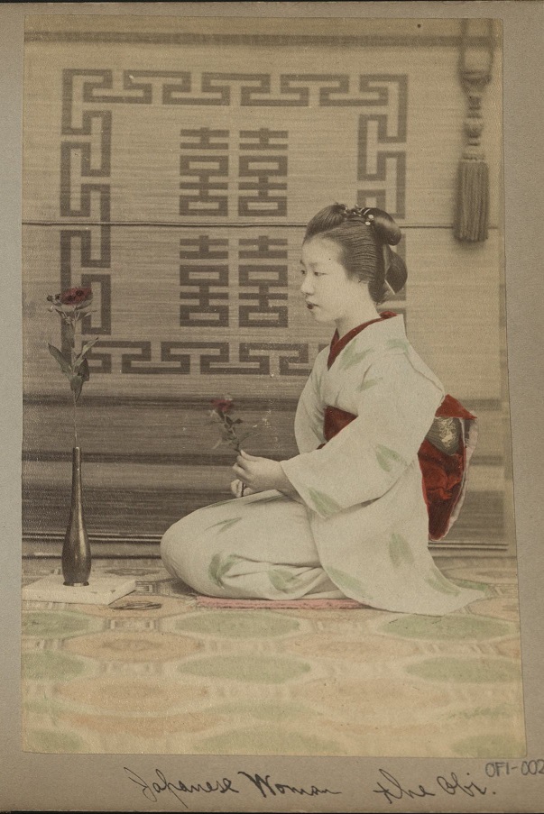 Japanese woman. The obi [sash].