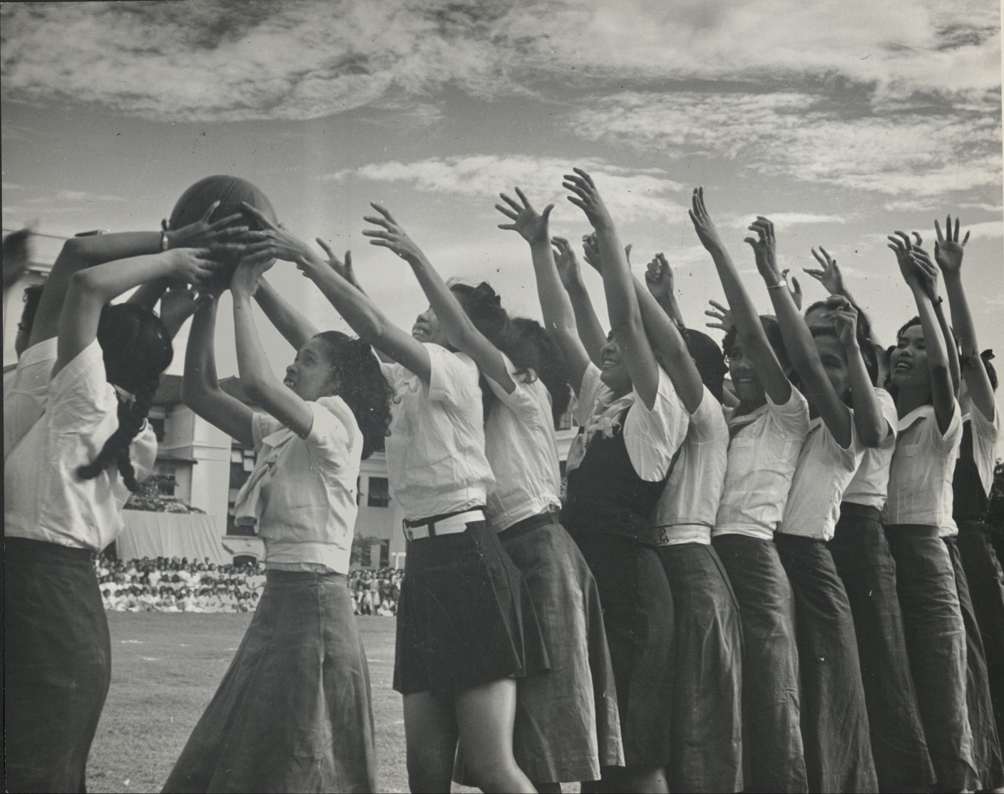 325. PHILIPPINES. Basketball, a sport imported from America, is popular. This all-girl team of a Manila school is putting on a good show.