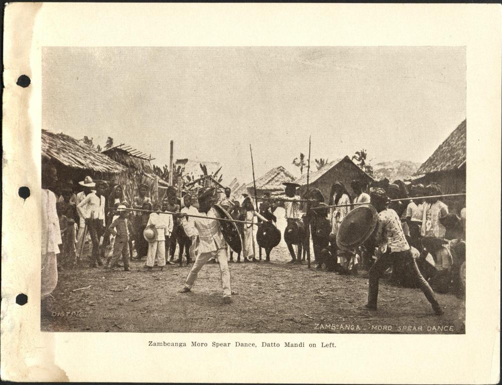 Zamboanga Moro spear dance. Datto Mandi on left.