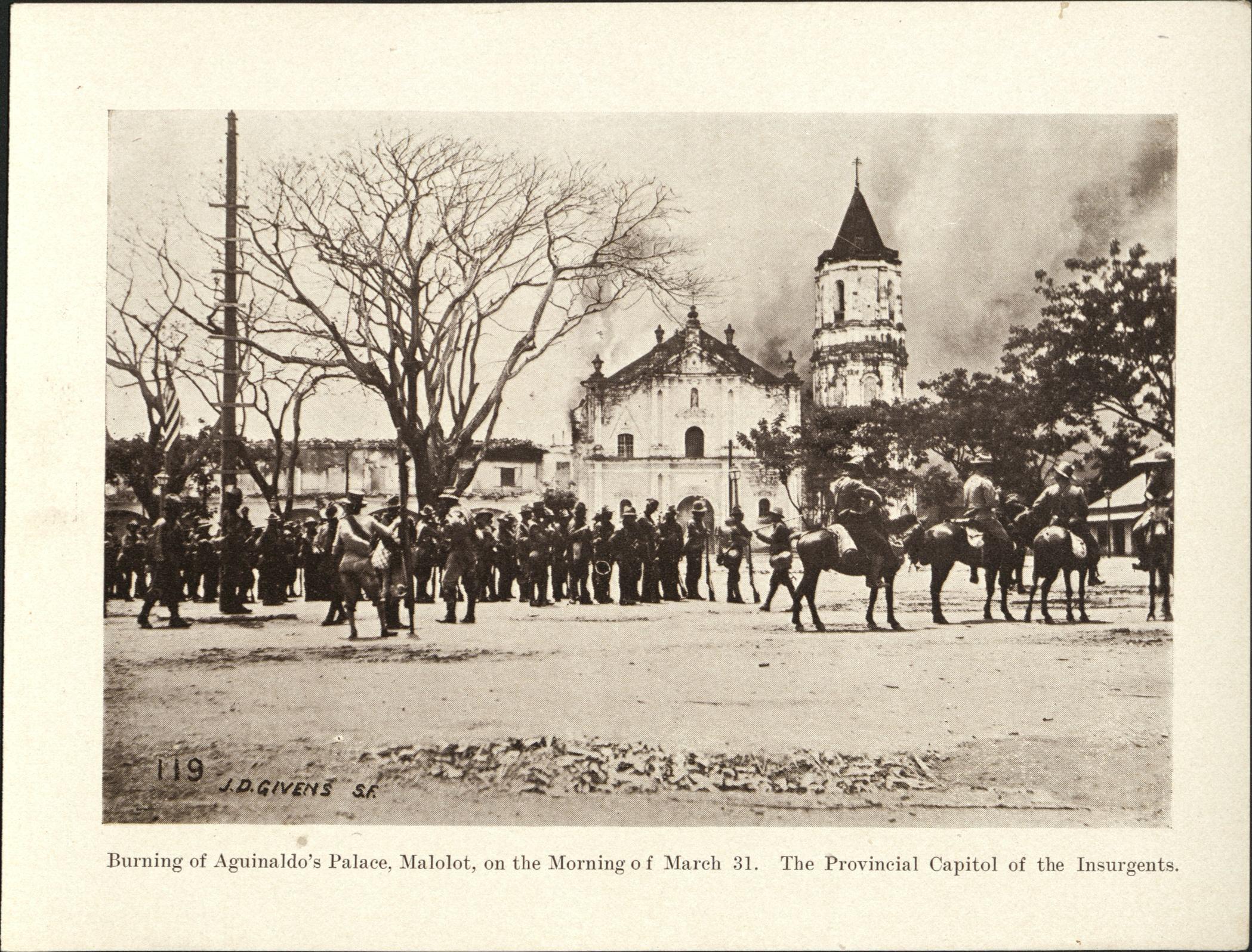 119. Burning of Aguinaldo’s Palace, Malolot [Malolos], on the morning of March 31. The provisional capitol of the insurgents.