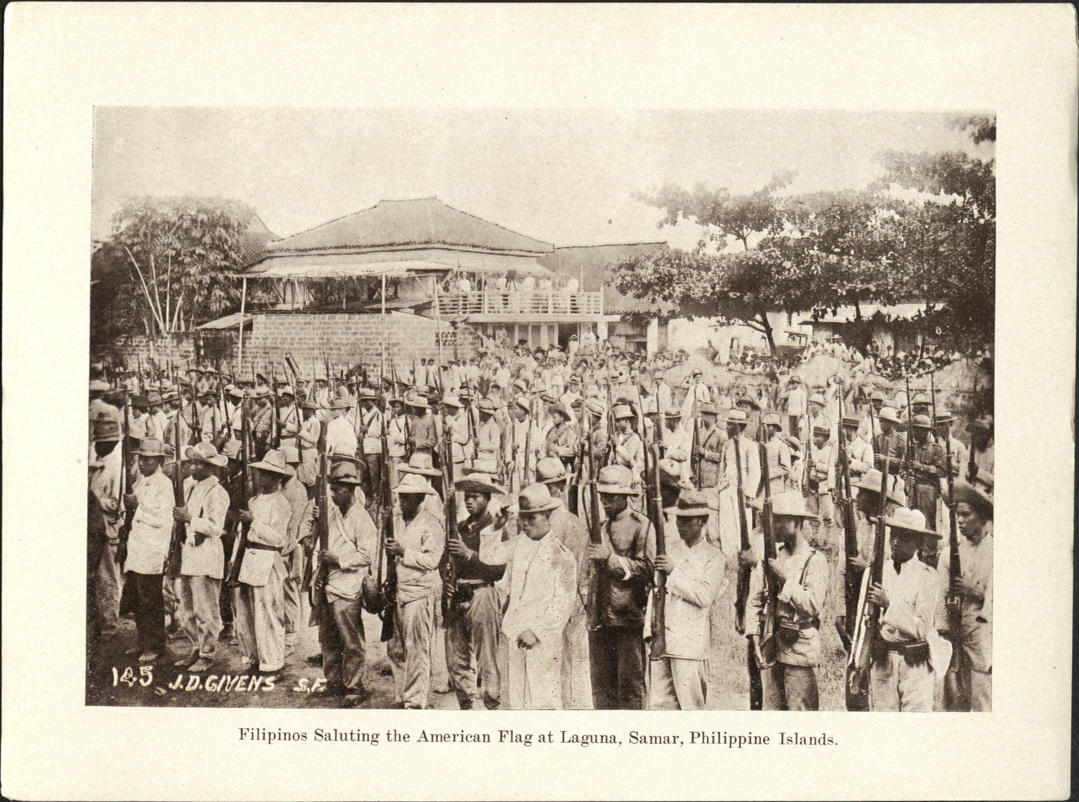 145. Filipinos saluting the American flag at Laguna [Laguan], Samar, Philippine Islands.