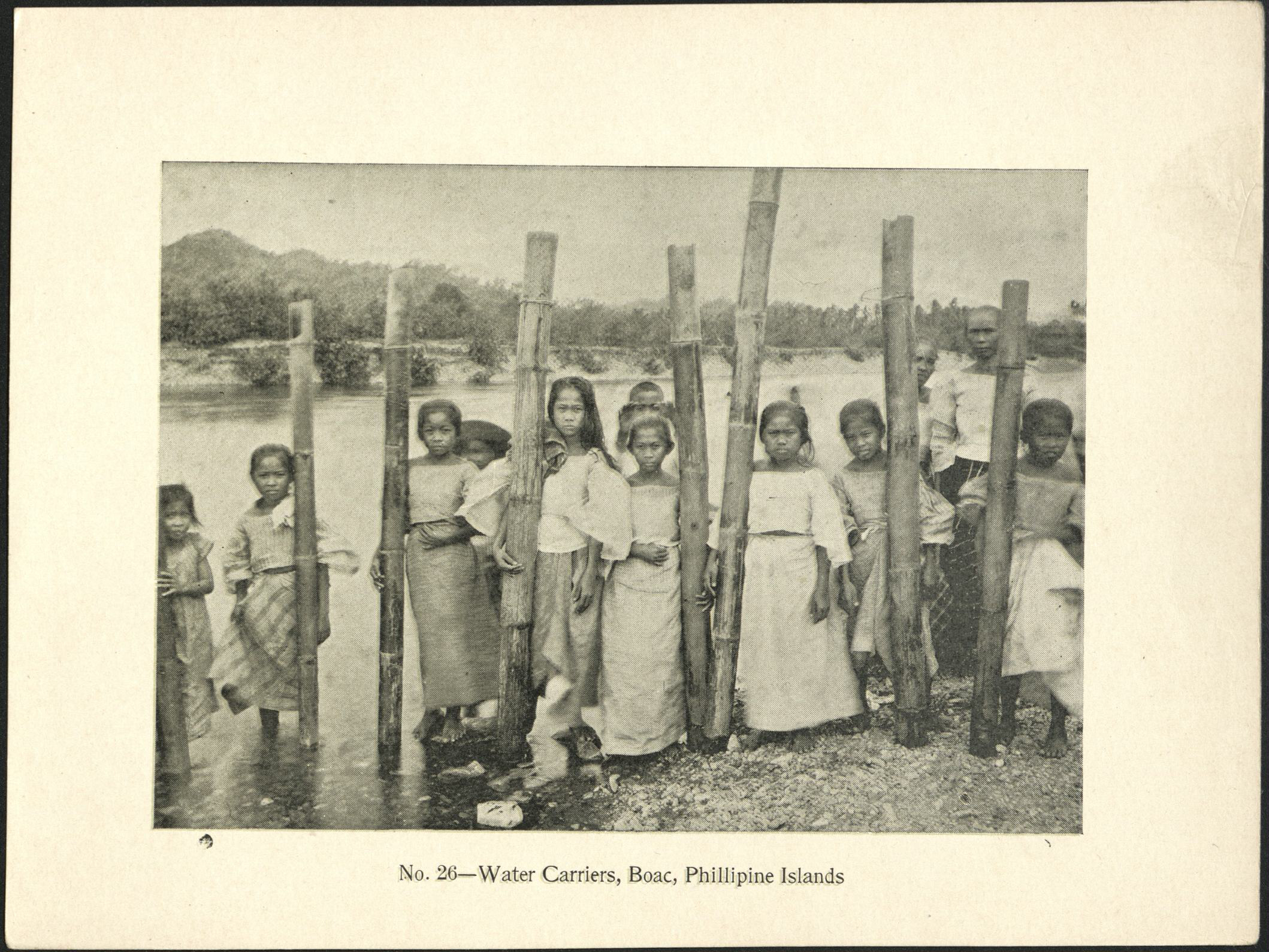 No. 26 – Water carriers, Boac, Philippine Islands.