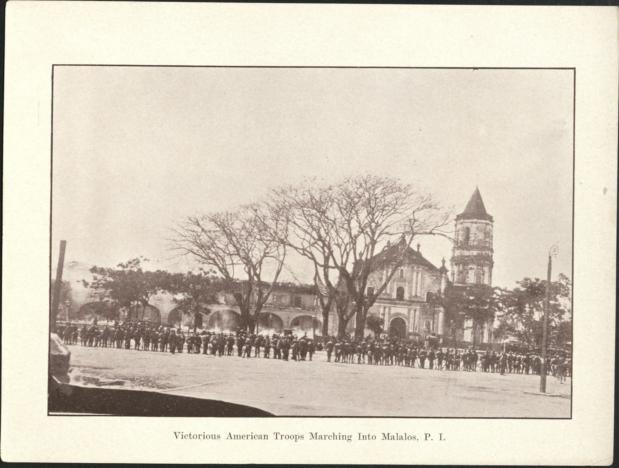 Victorious American troops marching into Malalos [Malolos], P. I.