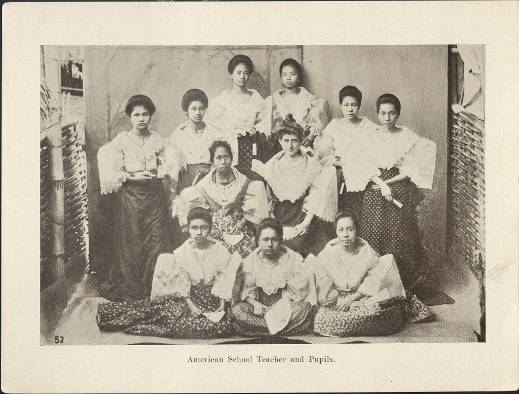 52. American school teacher and pupils.
