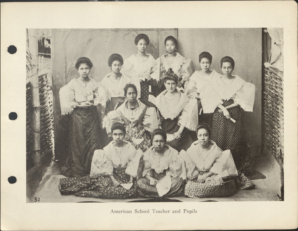 52. American school teacher and pupils.
