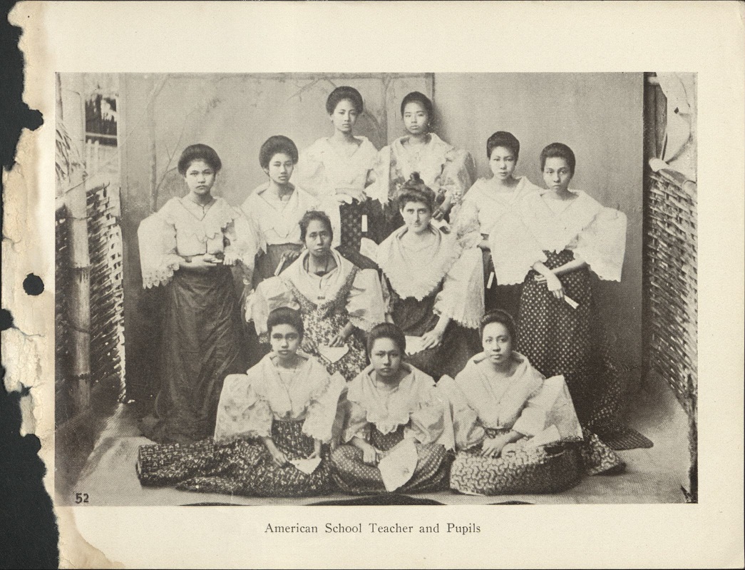 52. American school teacher and pupils.
