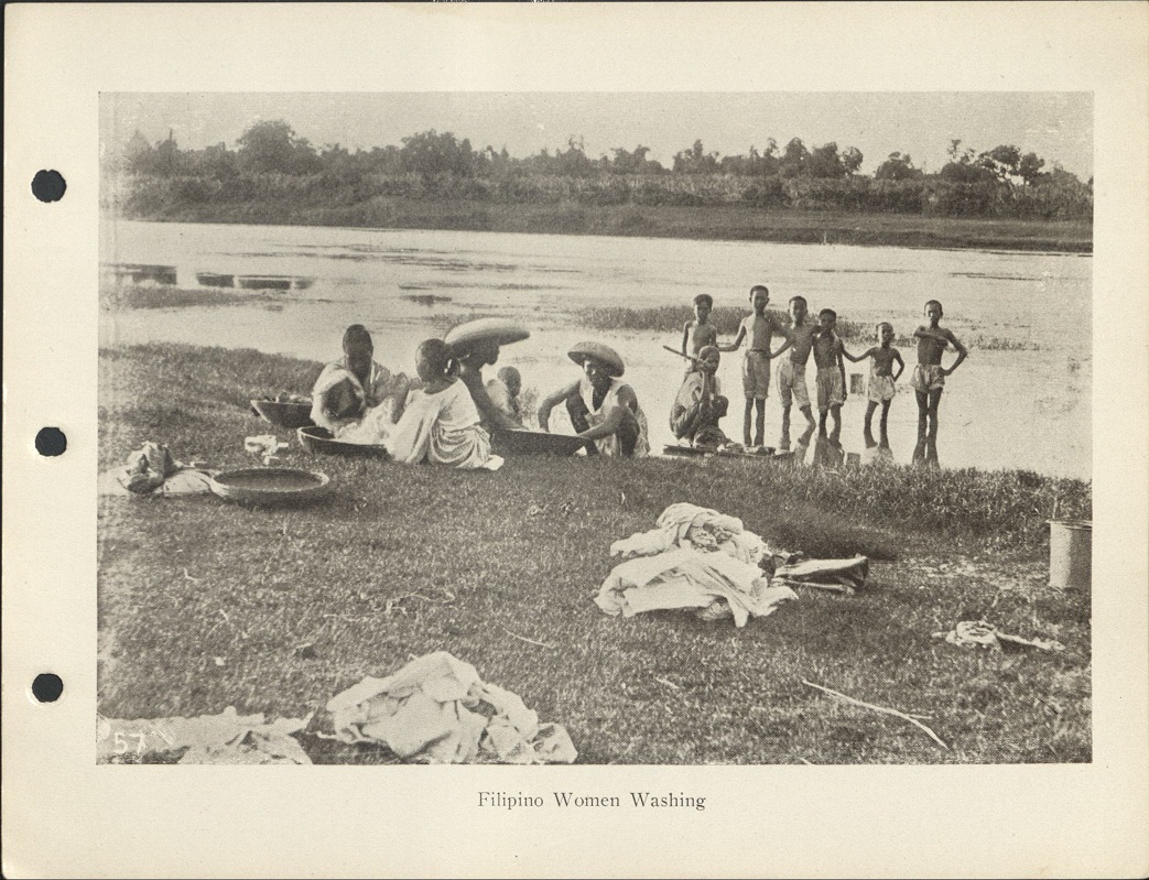 57. Filipino women washing.