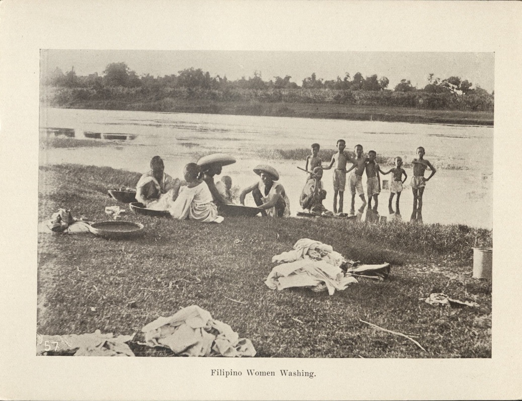 57. Filipino women washing.