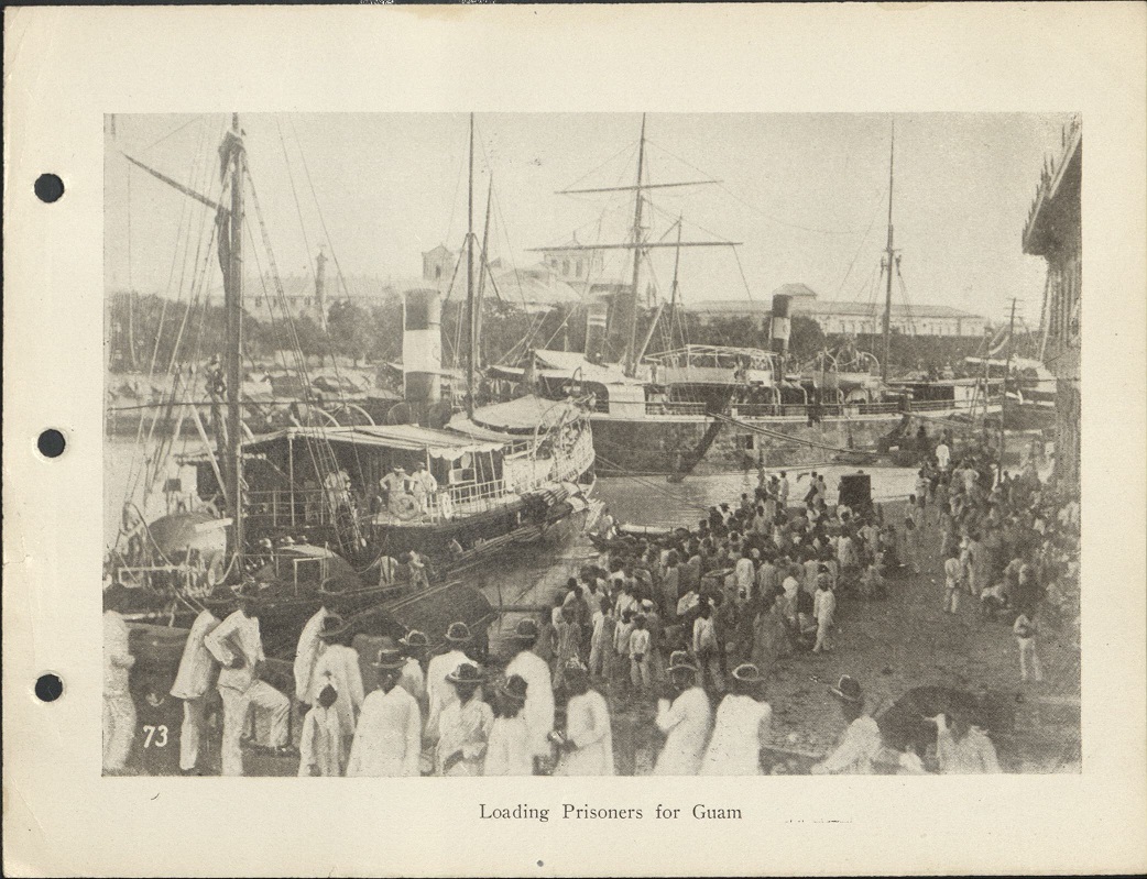 73. Loading prisoners for Guam.