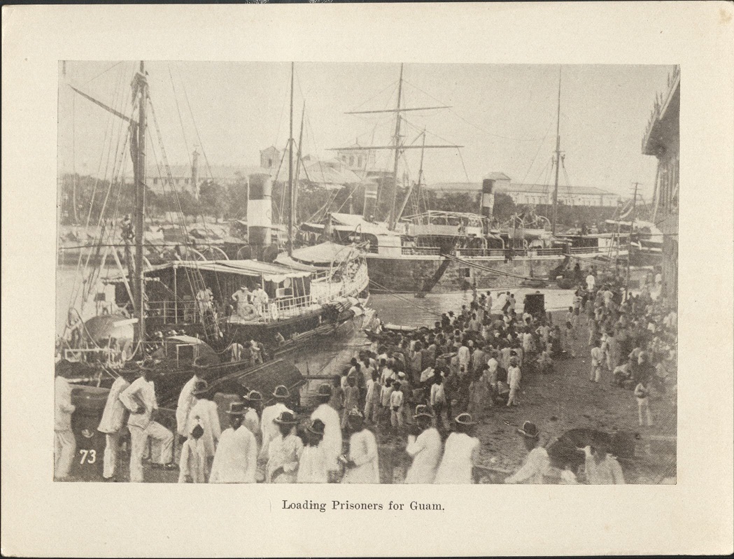 73. Loading prisoners for Guam.