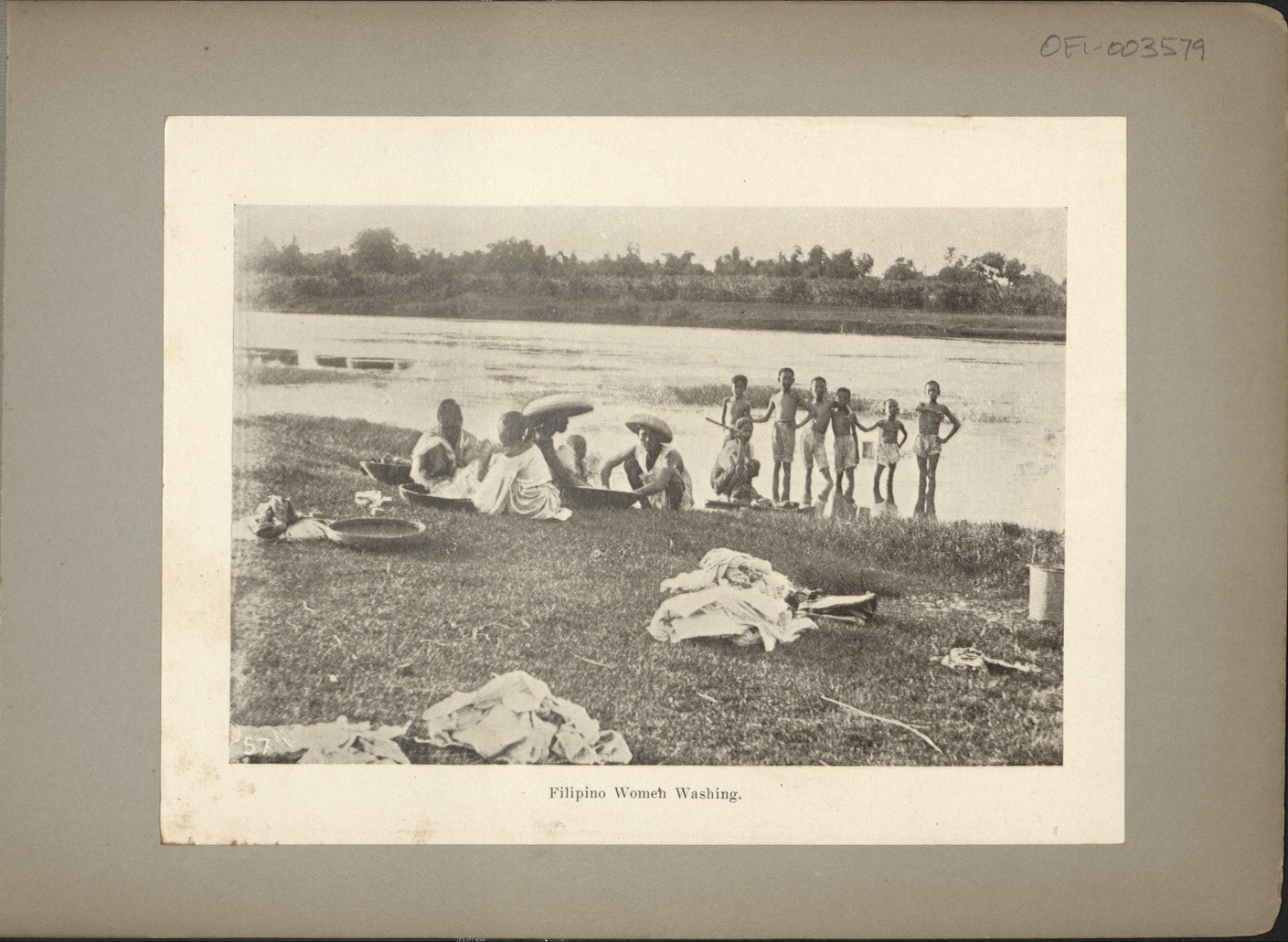 57. Filipino women washing.