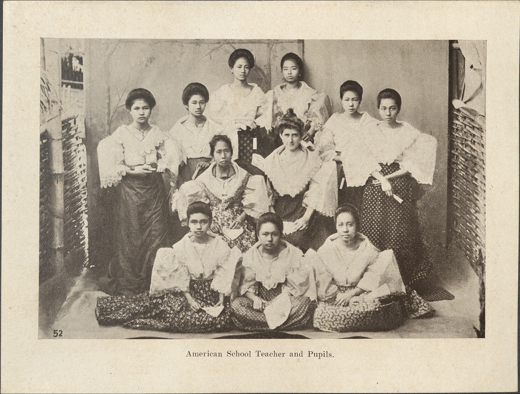 52. American school teacher and pupils.