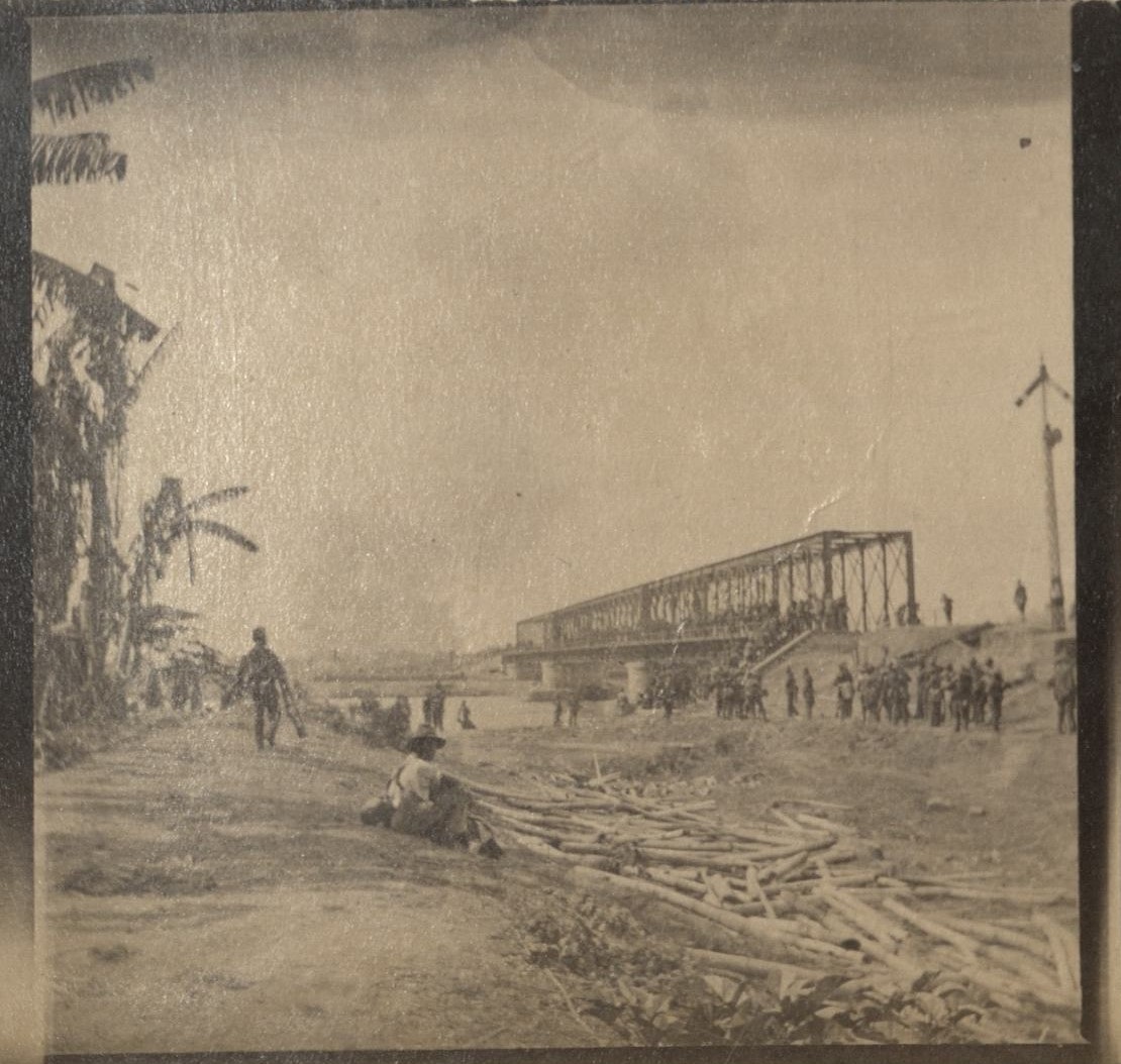 [Untitled – Soldiers surround railroad bridge over the Pampanga River].