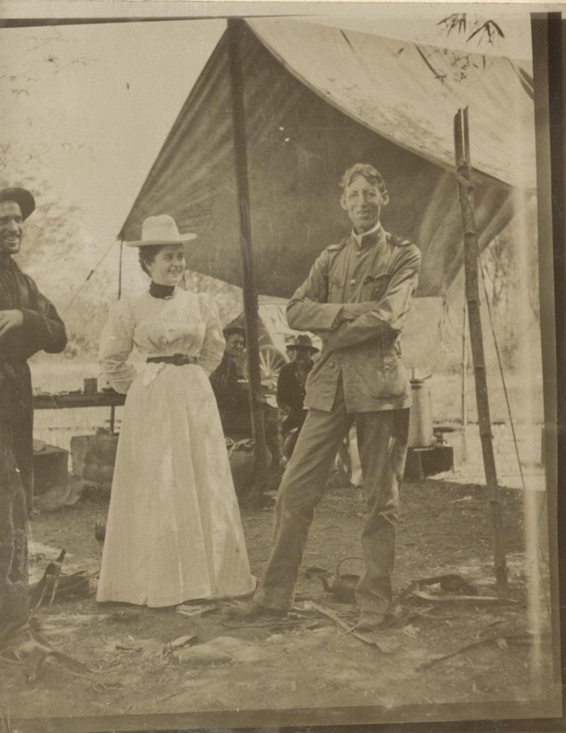 [Untitled – U.S. soldiers pose with an American woman by an army tent].