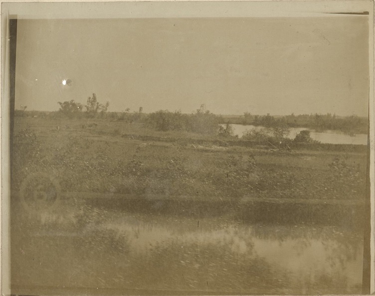 [Untitled – Activity on the far canal bank].