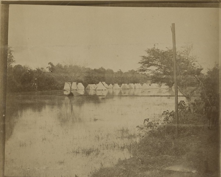 [Untitled – Army tents on a flooded riverbank].