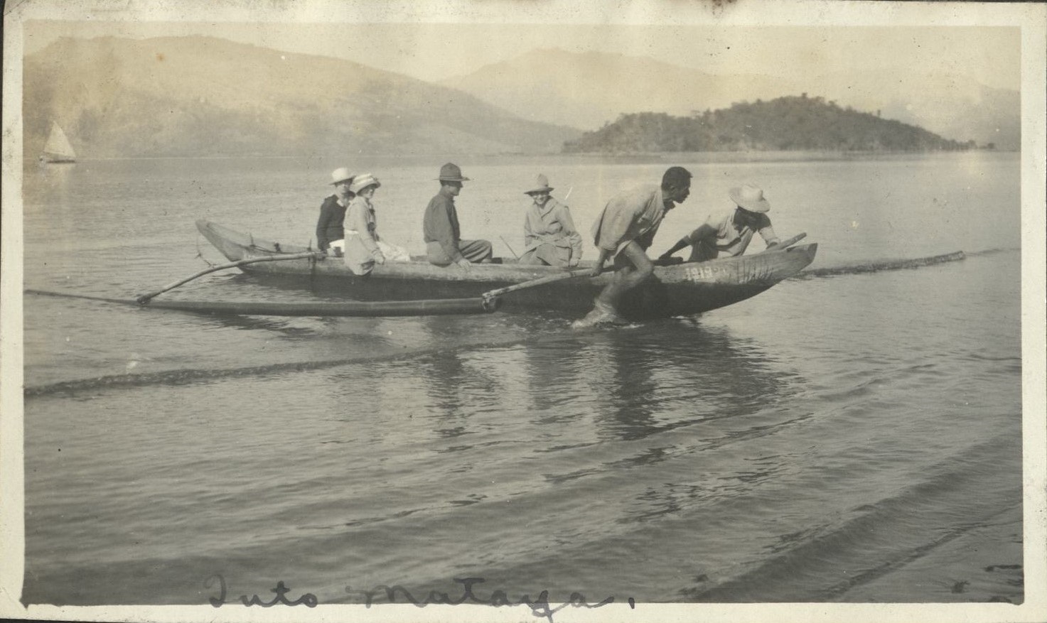 Tuto Mataya(?) [Americans in an ourigger canoe landing on beach].