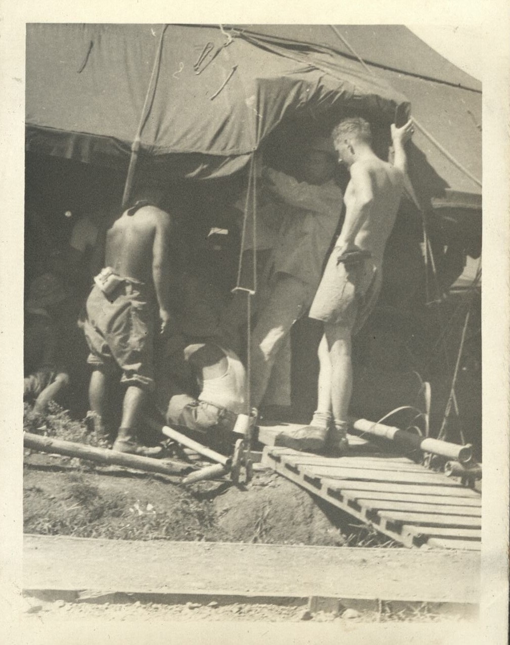 Seen around the 29th [Engineer Base Topographic Battalion. Soldiers in tent].