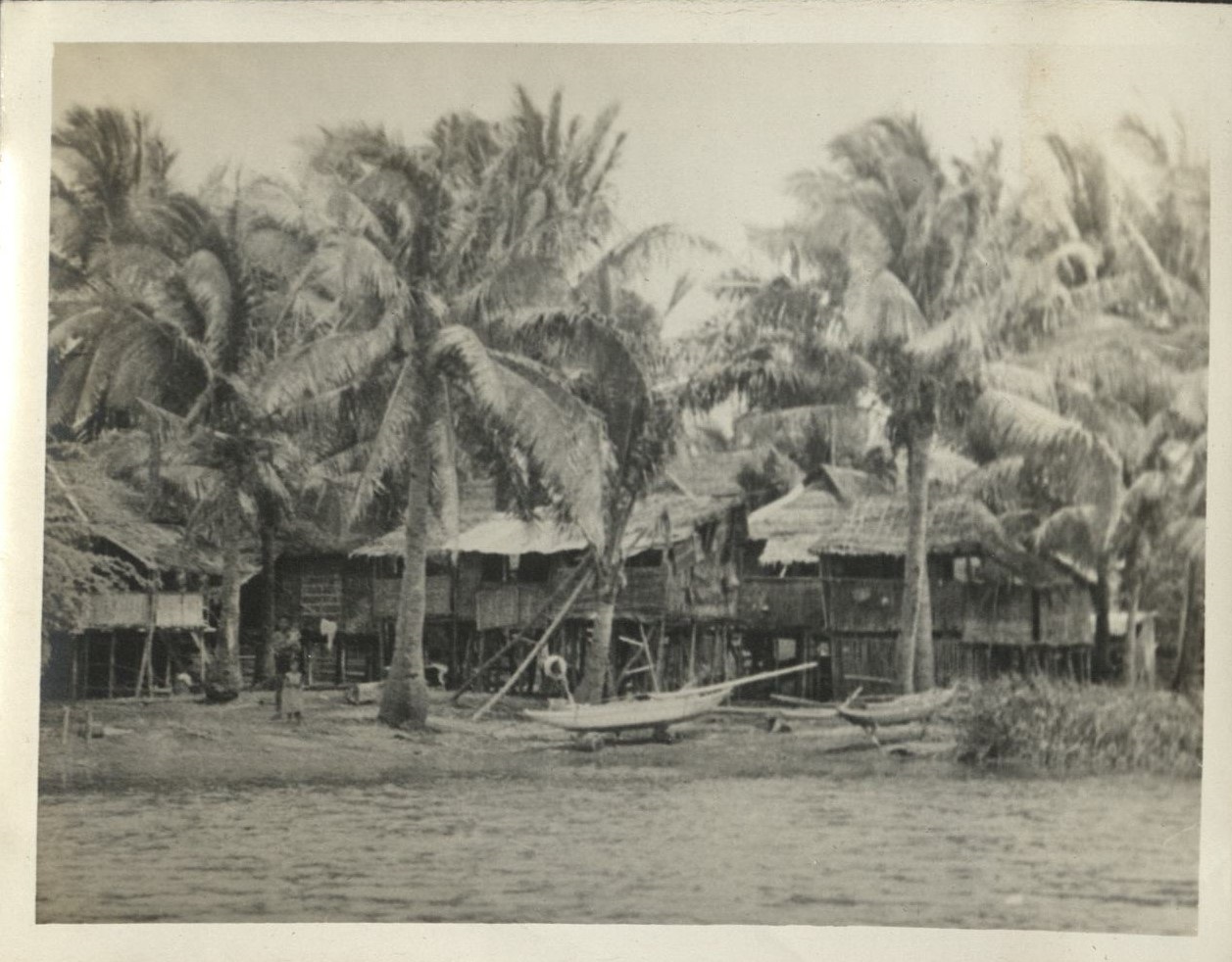 Boat trip up Taal [Pansipit] River [Boats and village on shore].