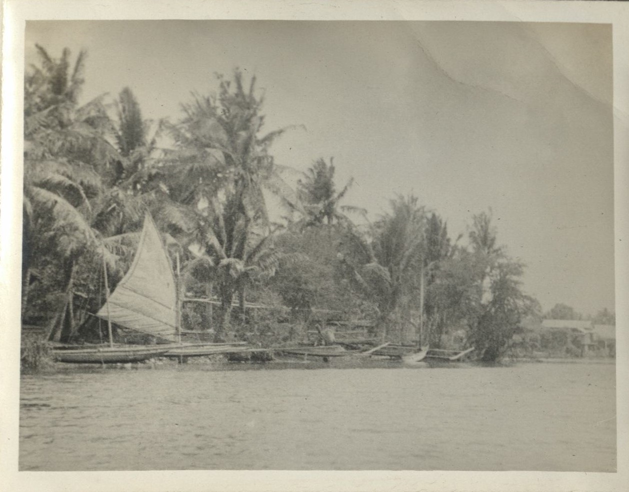 Boat trip up Taal [Pansipit] River [Boats and village on shore].