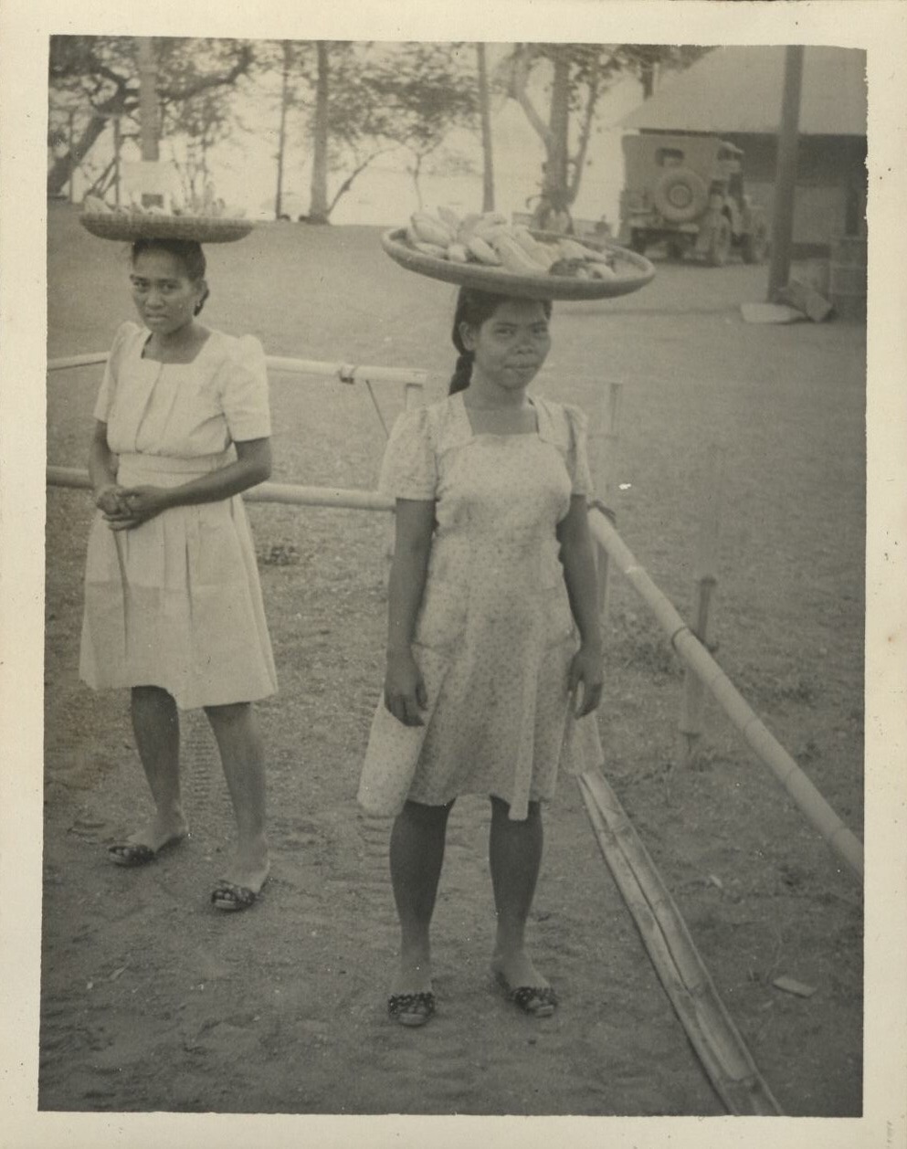The corn is green [Filipinas with head baskets].