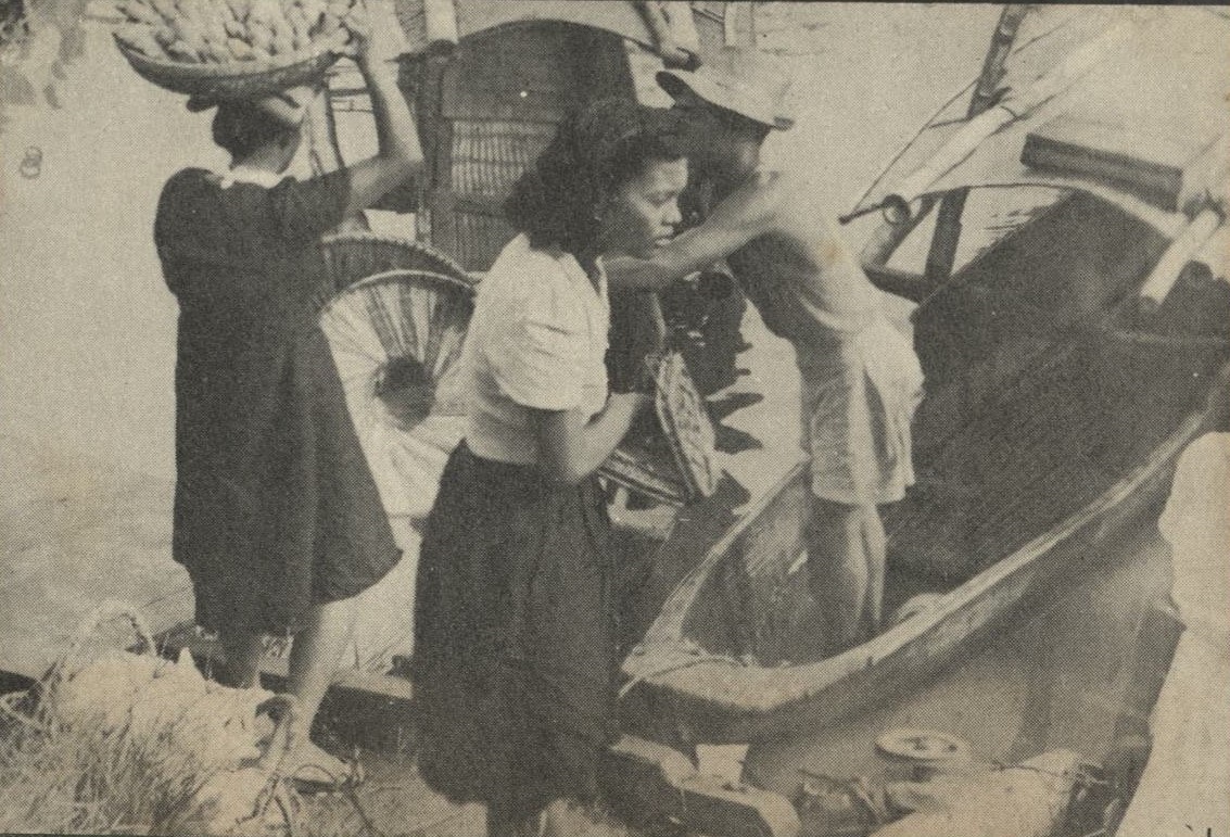 [Untitled – Young Filipinas boarding a local ferry boat on a river.].