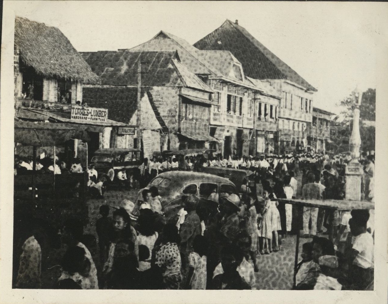 Remember Bataan? This is it. [Parade through town].