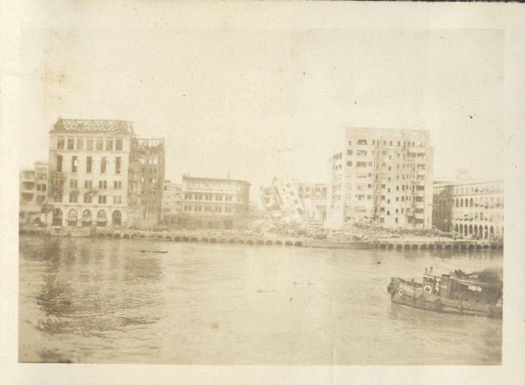 [Untitled – View across Pasig River to war-damaged buildings on Escolta].