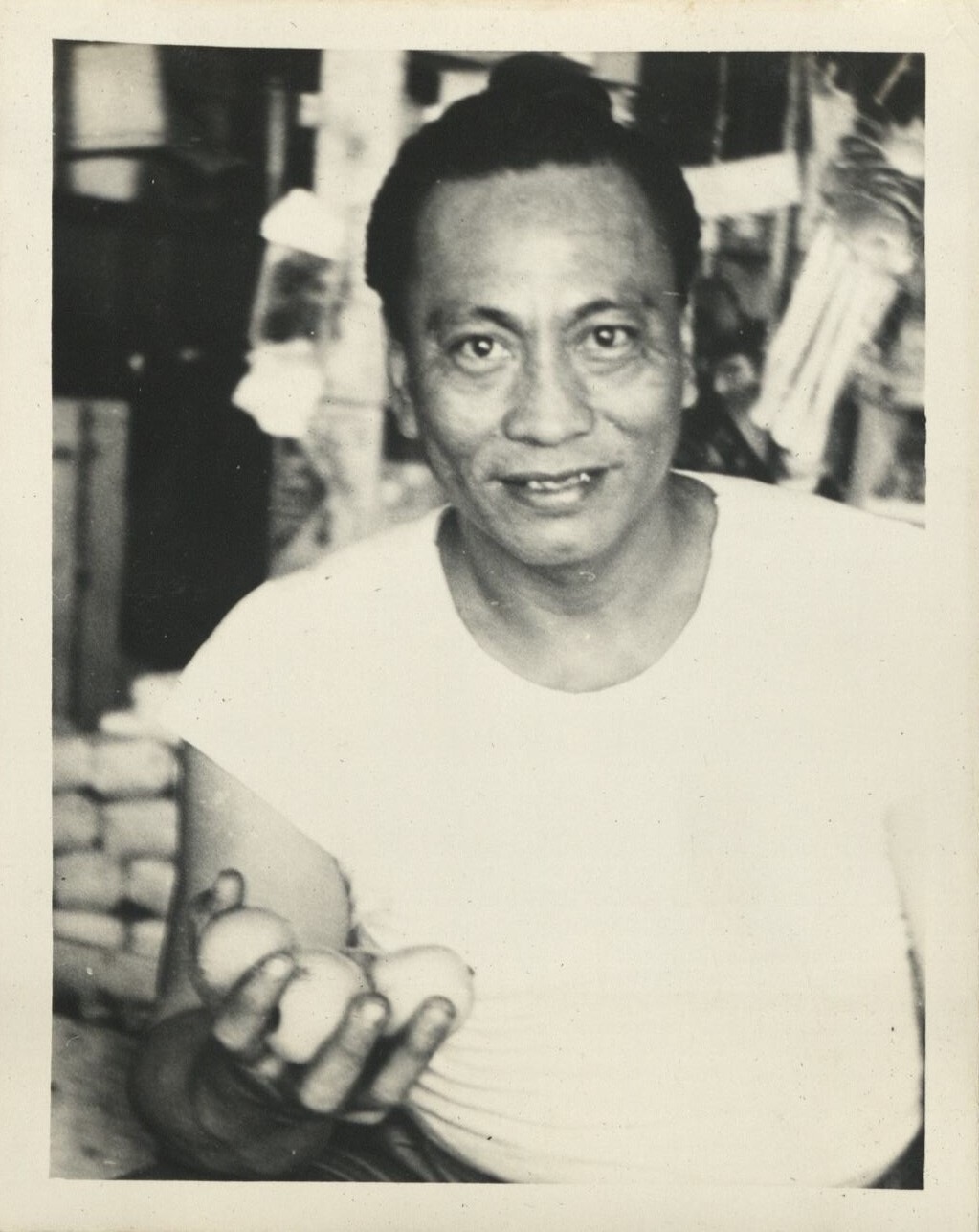 [Untitled – Filipino man holding lemons?].