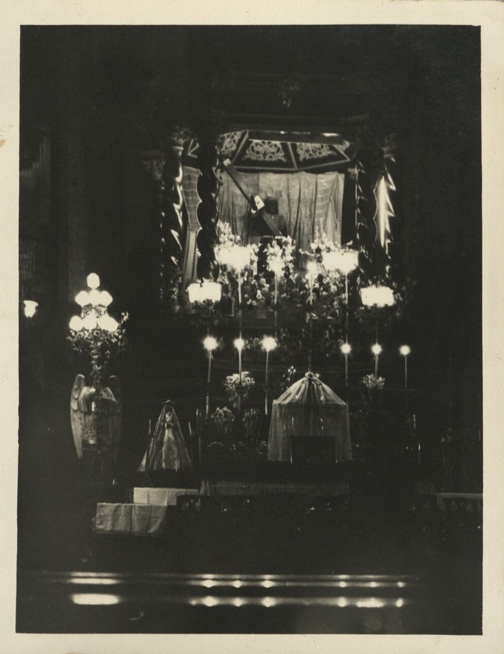 [Untitled – Church altar by candlelight].