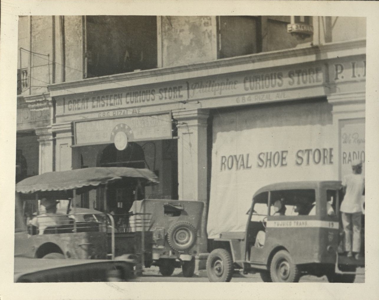 [Untitled – Royal Shoe Store and curio shops, Rizal Avenue, Manila].