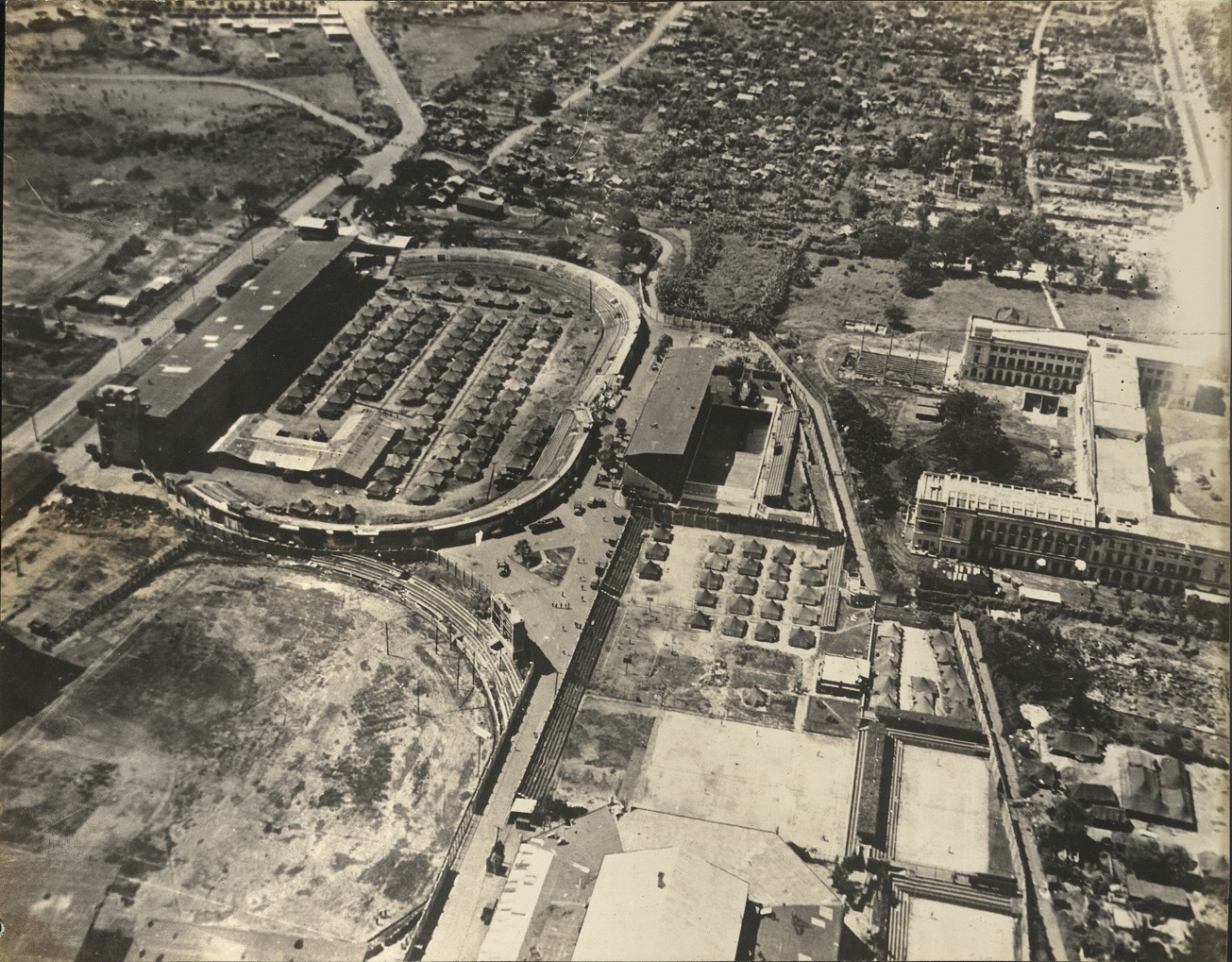 [Untitled – Aerial view of Rizal Memorial Sports Complex and De la Salle University, Malate – war-damaged].