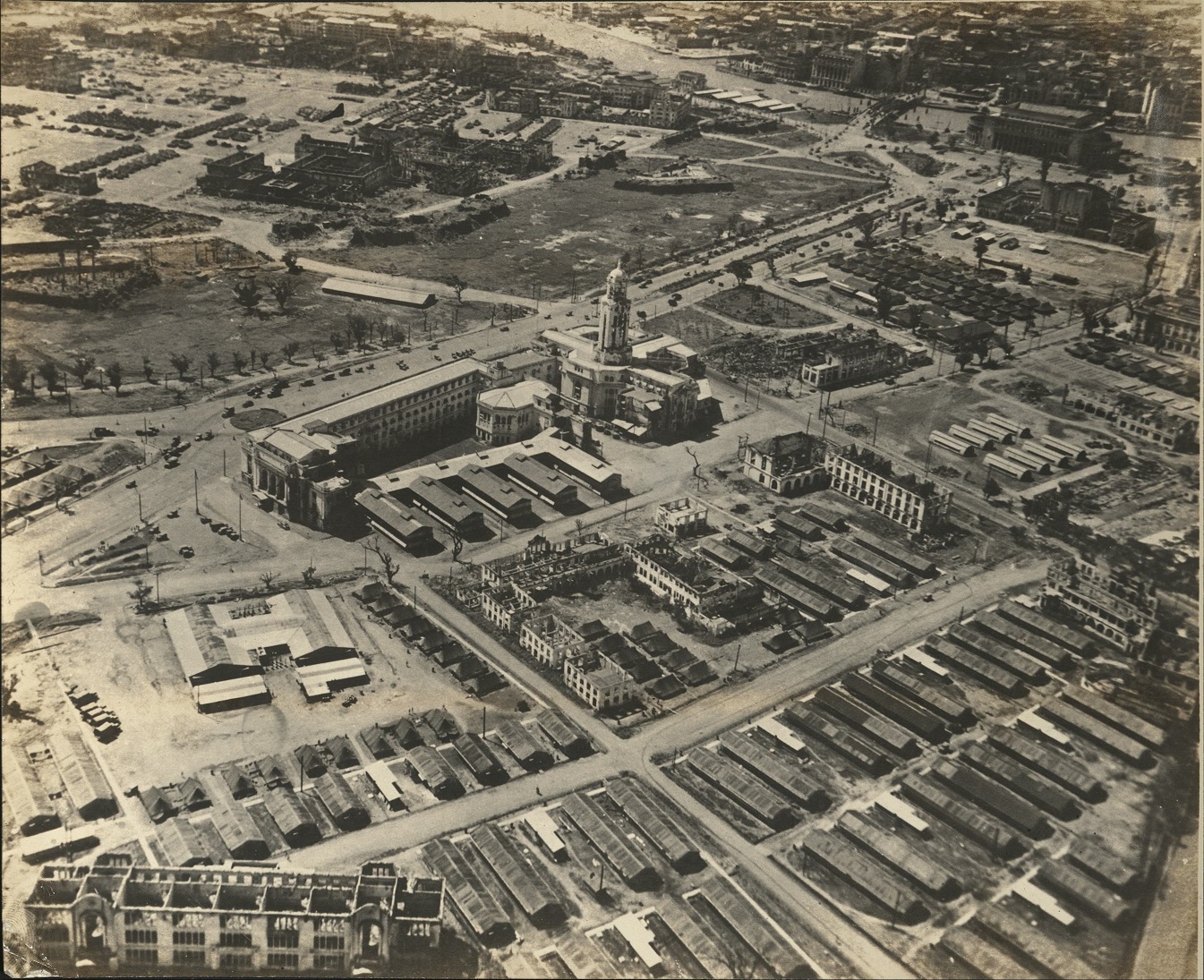 [Untitled – Aerial view of Manila City Hall and surrounding area, war-damaged].