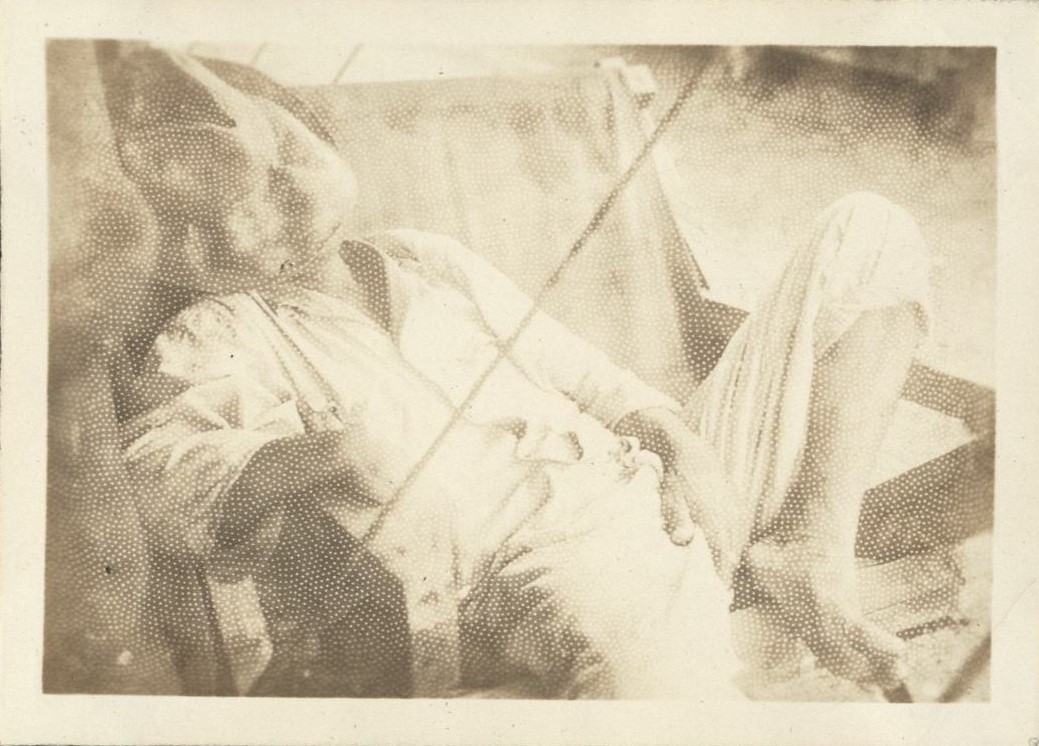 Ho-hum [Man sprawled and napping in a canvas sling chair].