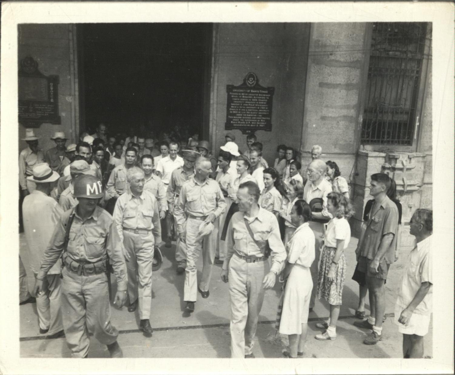 [Untitled – Philippine president Sergio Osmena greets freed detainees, tours Santo Tomas Internment Camp].