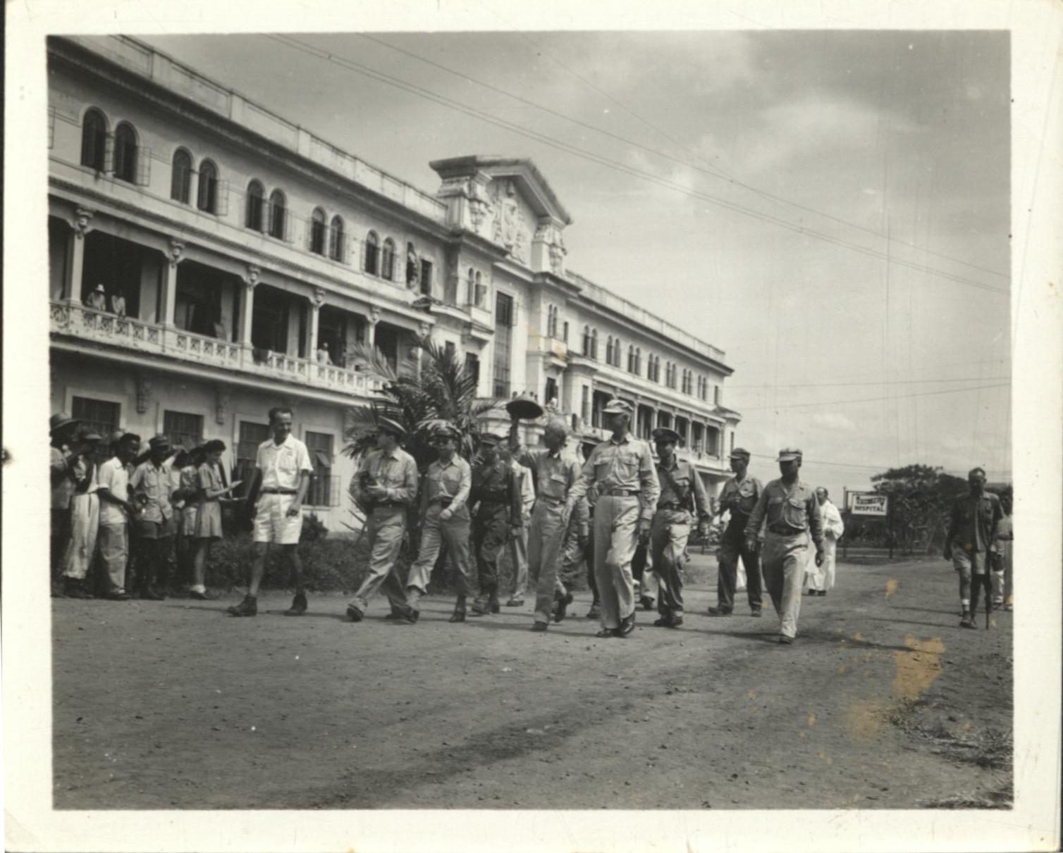 [Untitled – Philippine president Sergio Osmena greets freed detainees, tours Santo Tomas Internment Camp].