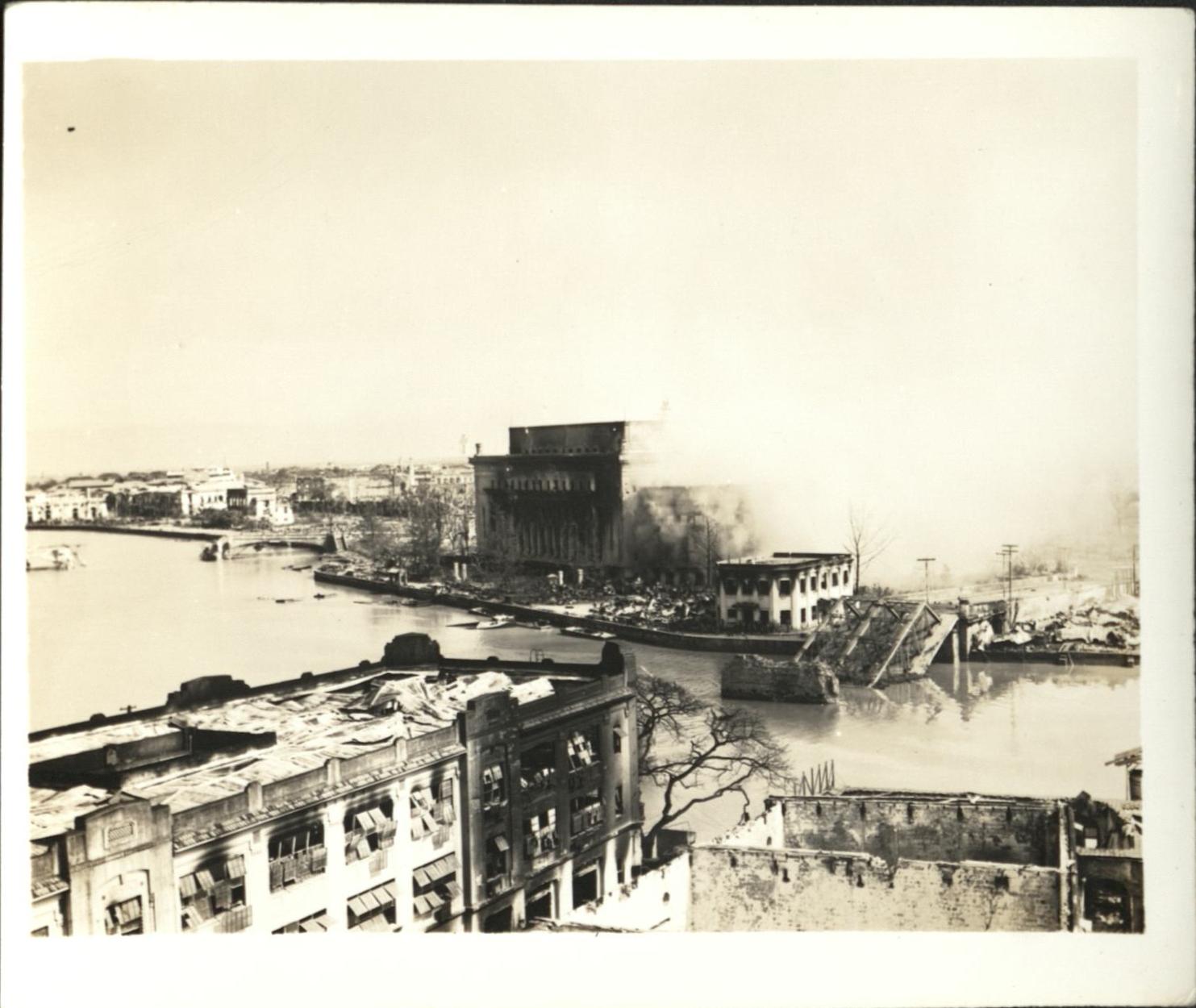 [Untitled – Urban warfare in Manila during liberation, across Pasig toward post office and destroyed Santa Cruz Bridge, February 1945].