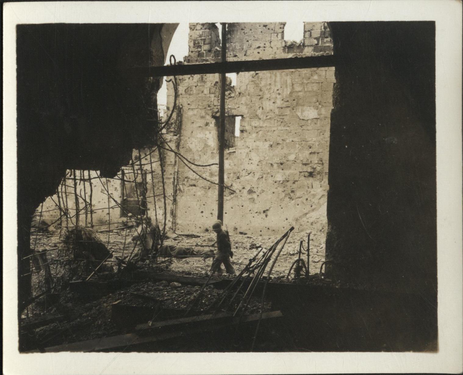 [Untitled – Urban warfare in Manila during liberation: Evacuating a casualty in Intramuros, February 1945].