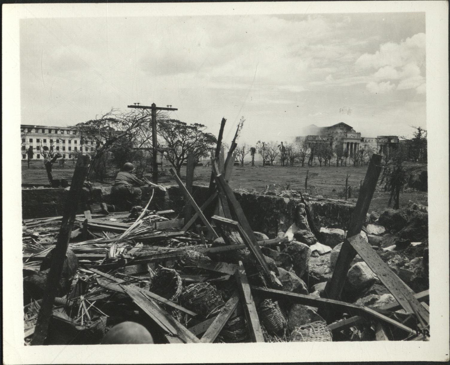 [Untitled – Destruction in Manila during liberation: Artillery shelling City Hall and the Legislative Building, February 1945].