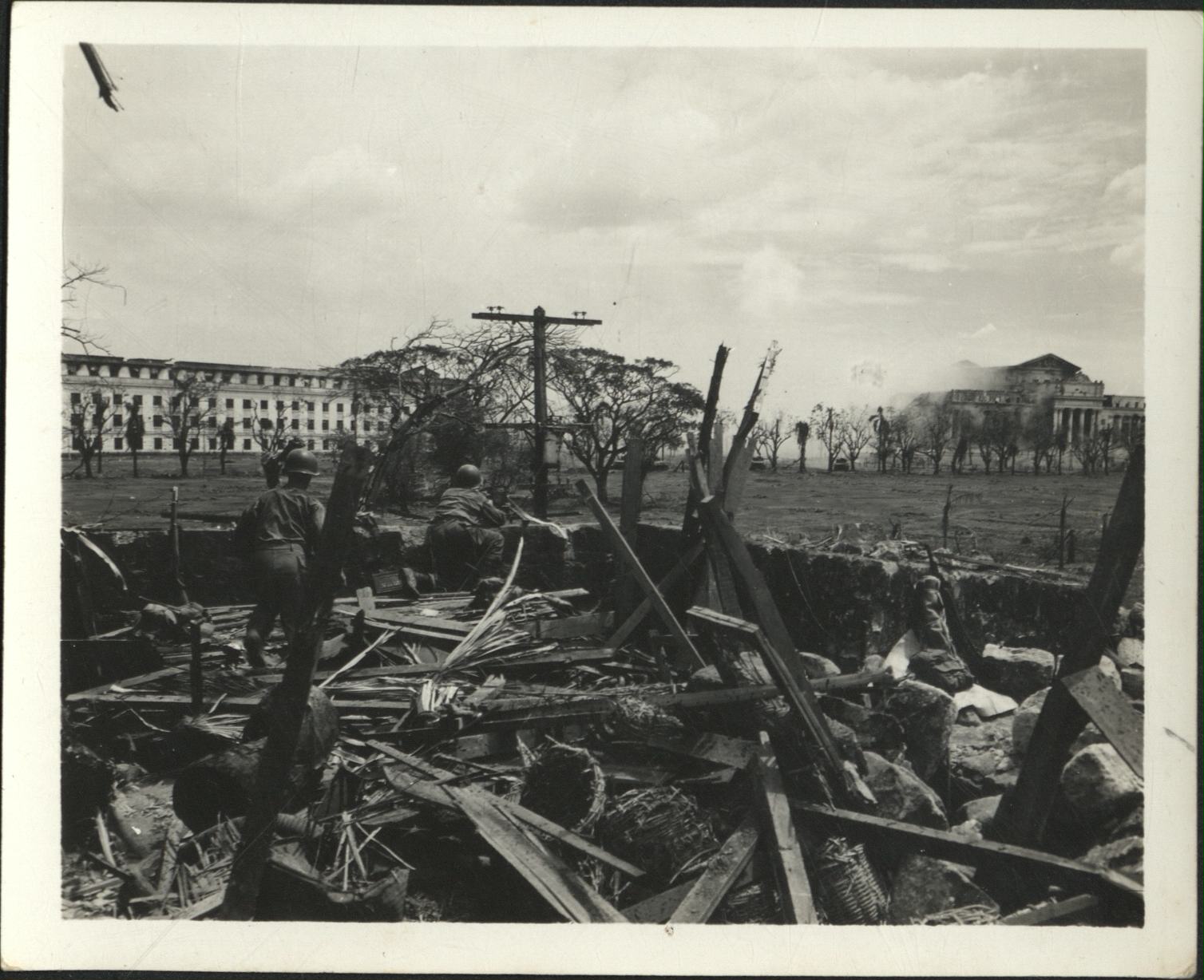 [Untitled – Destruction in Manila during liberation: Artillery shelling City Hall and the Legislative Building, February 1945].
