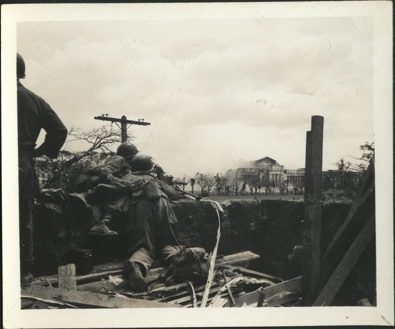 [Untitled – Destruction in Manila during liberation: Artillery shelling City Hall and the Legislative Building, February 1945].