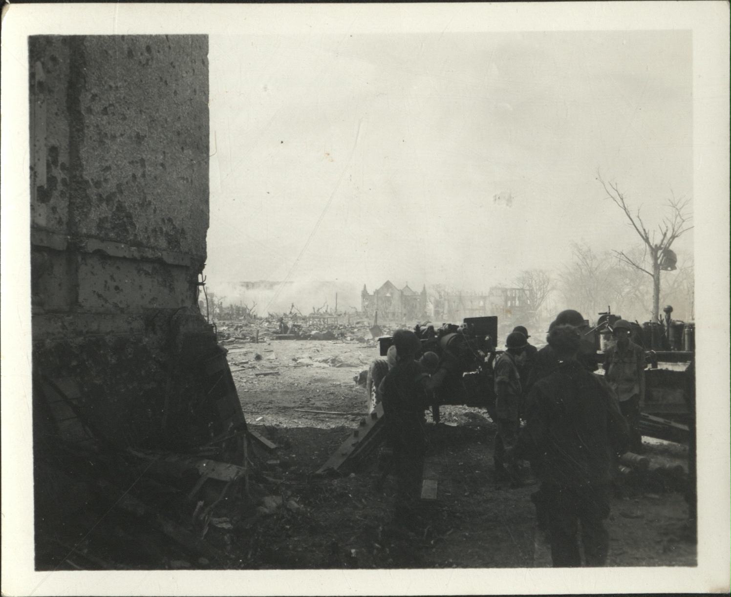 [Untitled – Destruction in Manila during liberation: Artillery firing from Legislative Building (?) toward Ermita and Central Methodist Church, February 1945].