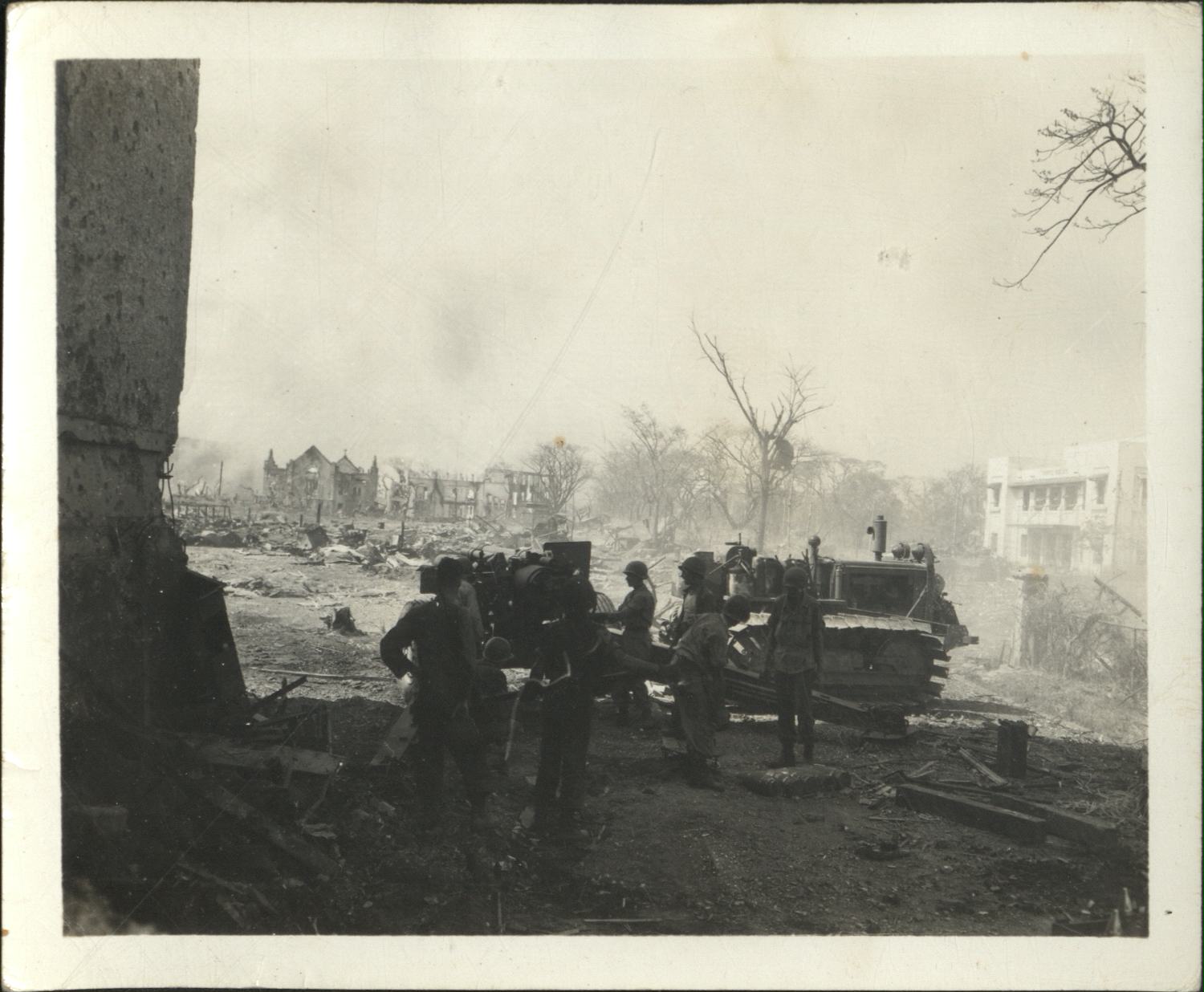 [Untitled – Destruction in Manila during liberation: Artillery firing from Legislative Building (?) toward Ermita and Central Methodist Church, February 1945].