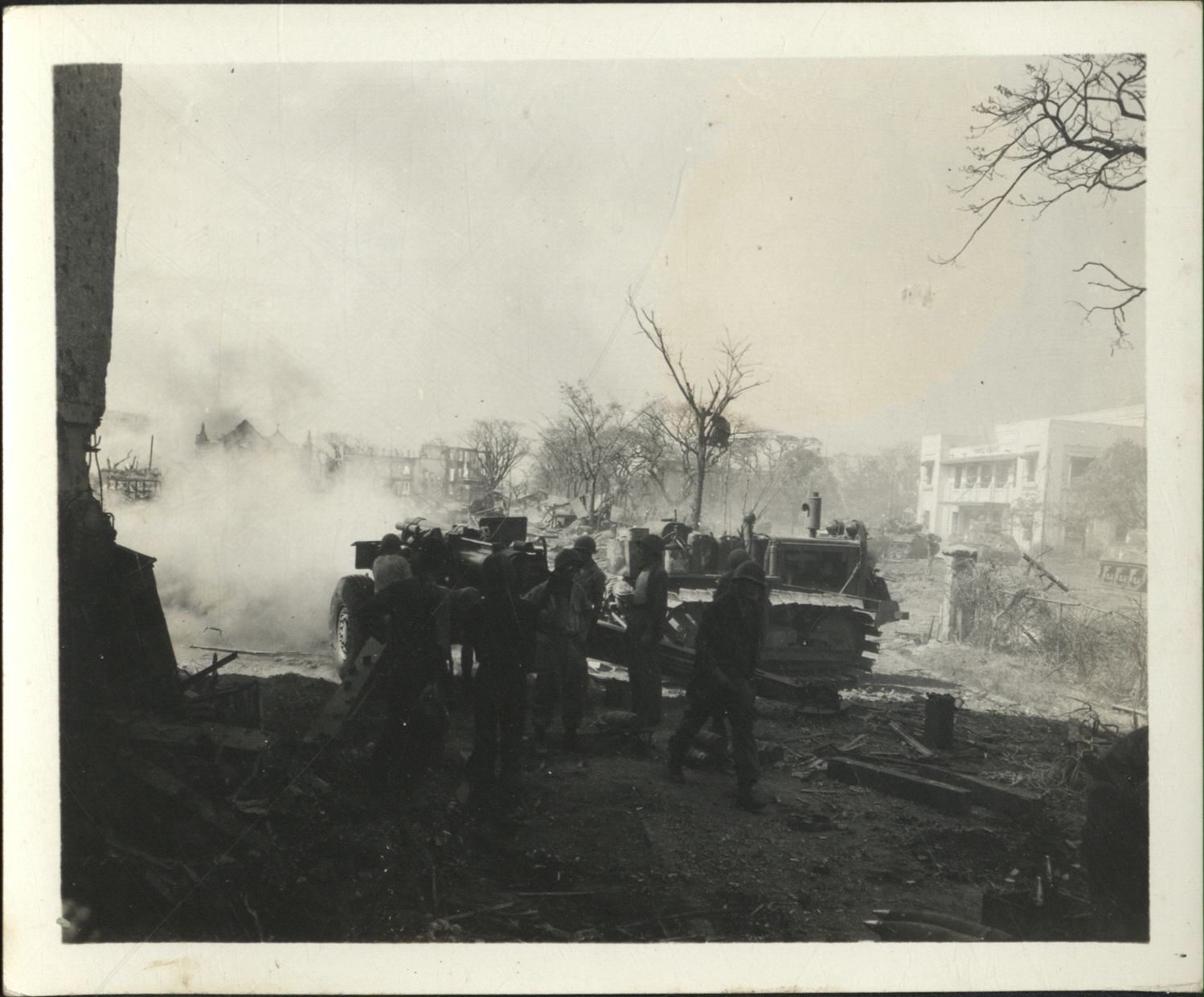 [Untitled – Destruction in Manila during liberation: Artillery firing from Legislative Building (?) toward Ermita and Central Methodist Church, February 1945].